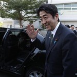 Japan's Prime Minister Shinzo Abe waves before he leaves the Thai-Nichi Institute of Technology in Bangkok January 17, 2013. Abe is on a one-day official visit to Thailand. REUTERS/Kerek Wongsa